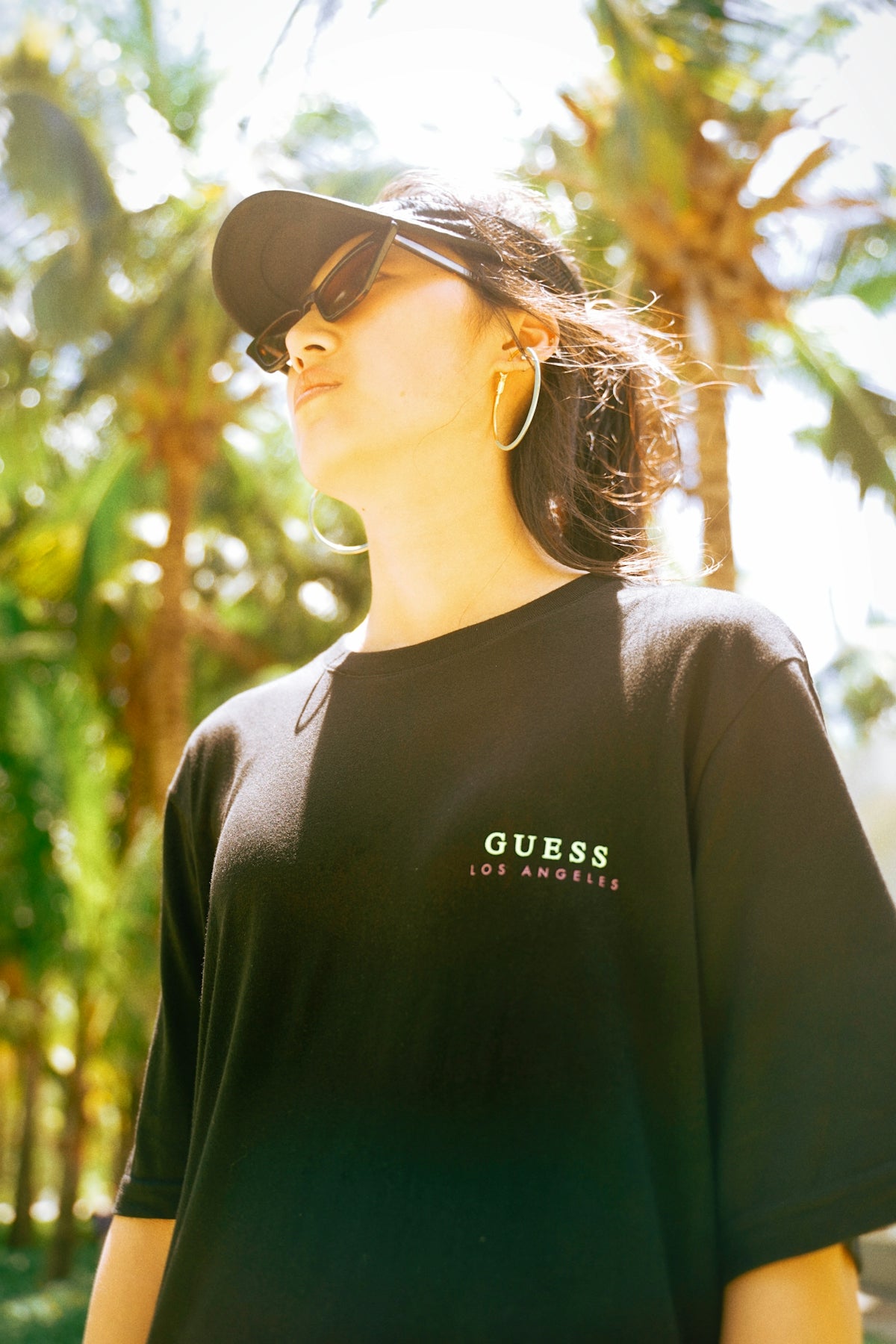 woman in black crew neck shirt wearing black sunglasses