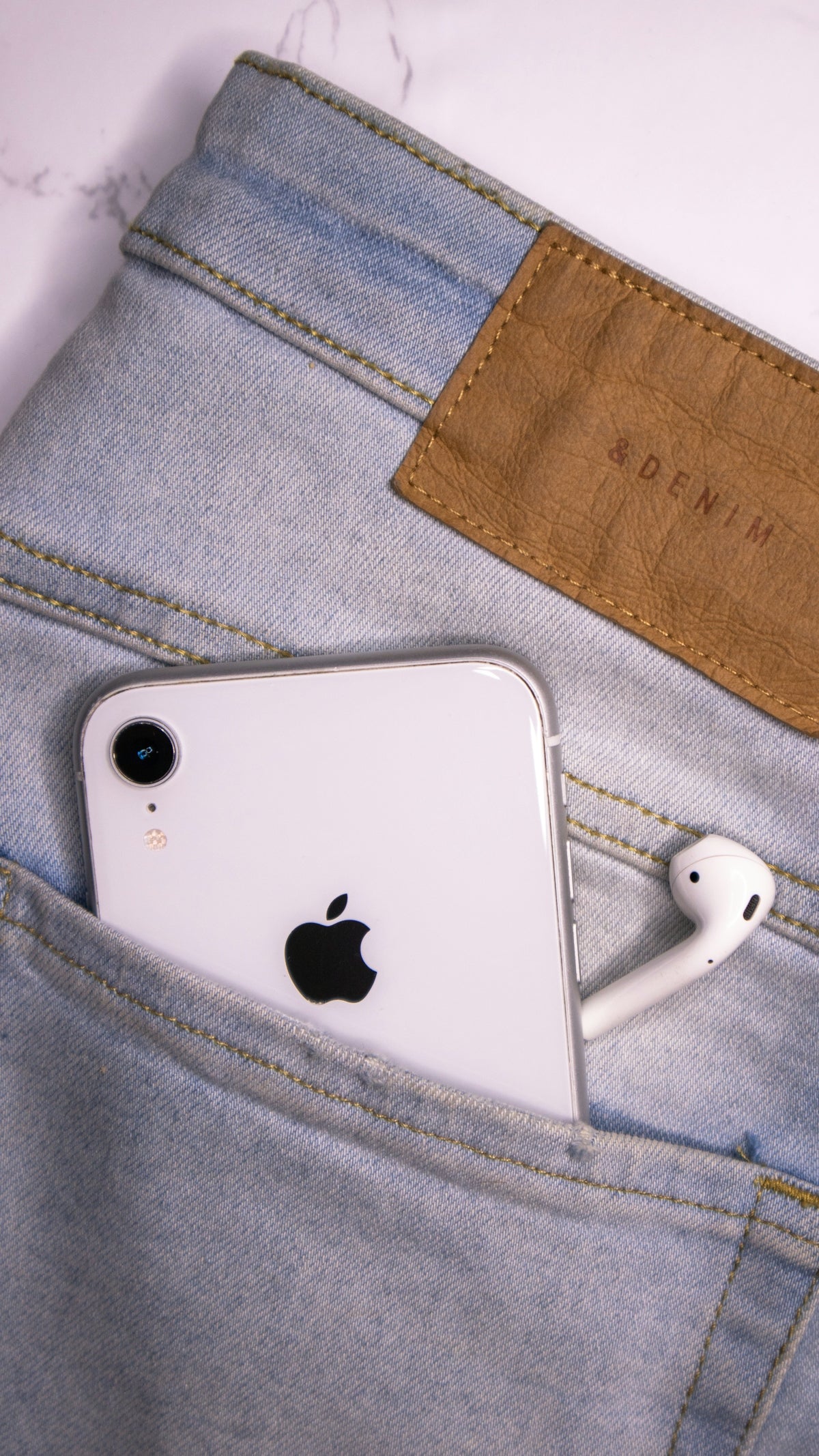 gold iphone 6 on gray textile