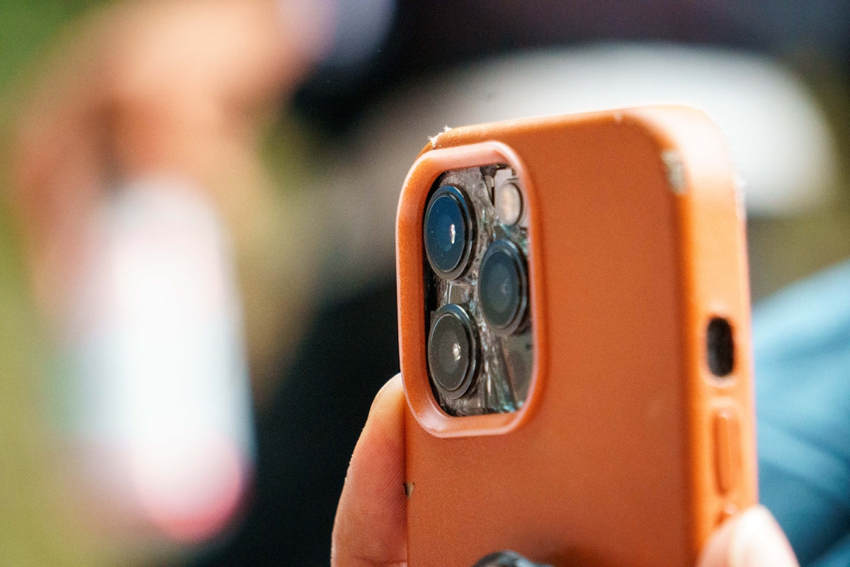 a close up of a person holding a cell phone