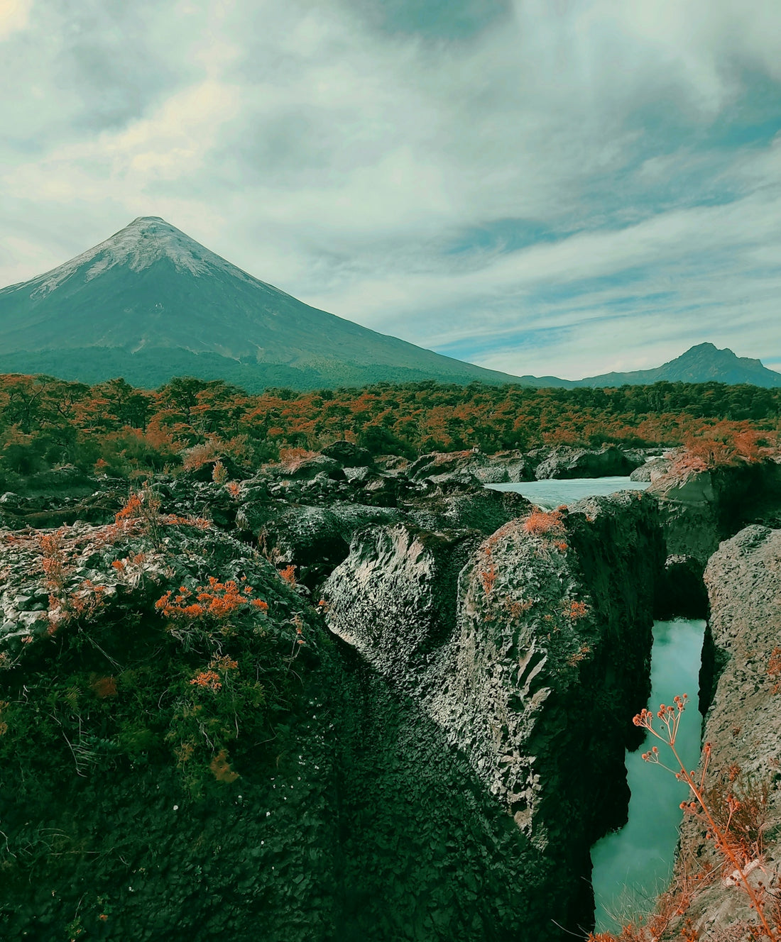 a mountain with a river running through it