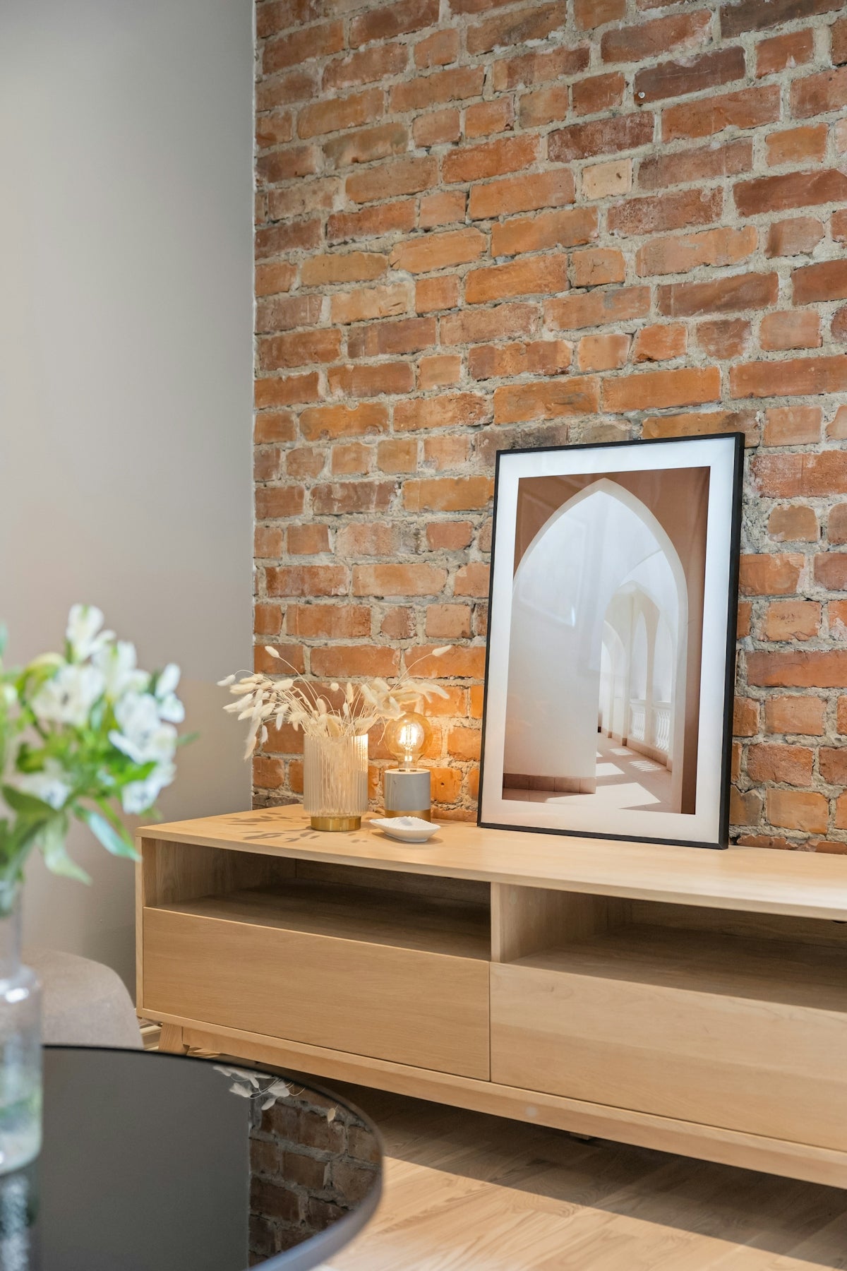 A picture of a room with a brick wall